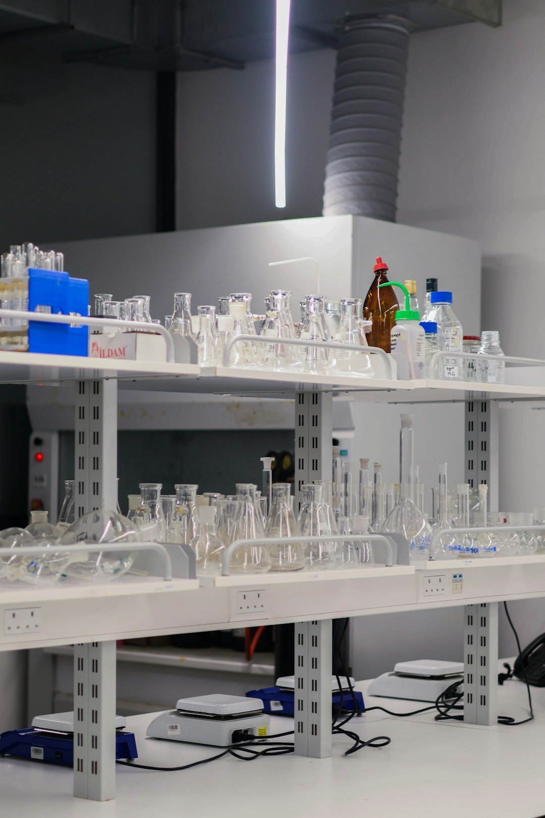 White humanoid robot in a modern lab