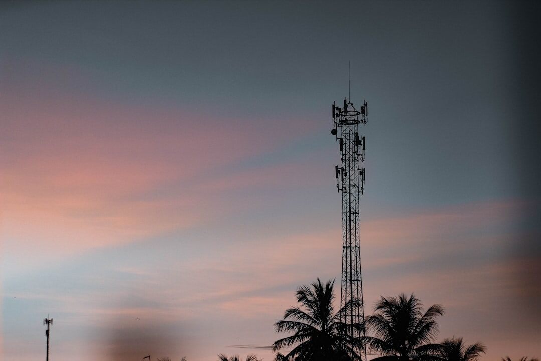 5G network tower with glowing signal waves