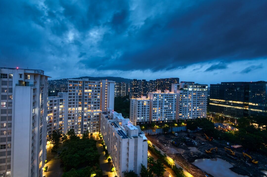 Modern drone flying over urban landscape at dusk