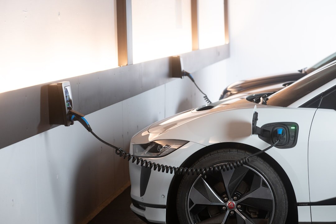 Electric car charging at modern charging station